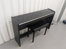 Load image into Gallery viewer, Roland F140R Digital Piano in satin black slim line space saver stock # 25303