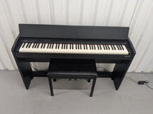 Load image into Gallery viewer, Roland F140R Digital Piano in satin black slim line space saver stock # 25303