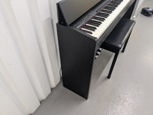 Load image into Gallery viewer, Roland F140R Digital Piano in satin black slim line space saver stock # 25303