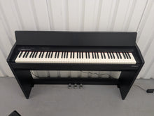 Load image into Gallery viewer, Roland F140R Digital Piano in satin black slim line space saver stock # 25303
