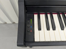 Load image into Gallery viewer, Roland RP102 digital piano in satin black finish stock number 25333