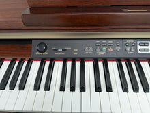 Load image into Gallery viewer, Yamaha Clavinova CLP-150 digital piano and stool in mahogany stock #25337