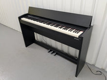 Load image into Gallery viewer, Roland F140R Digital Piano in satin black slim line space saver stock # 25351