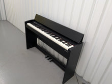 Load image into Gallery viewer, Roland F140R Digital Piano in satin black slim line space saver stock # 25351