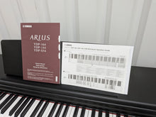 Load image into Gallery viewer, Yamaha Arius YDP-144 digital piano and stool in satin black stock nr 25401