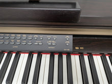 Load image into Gallery viewer, Yamaha Clavinova CLP-150 digital piano and stool in dark rosewood stock #25409
