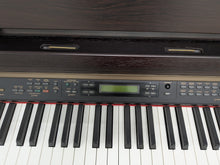 Load image into Gallery viewer, Yamaha Clavinova CLP-150 digital piano and stool in dark rosewood stock #25409