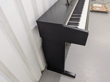 Load image into Gallery viewer, Yamaha Arius YDP-142 Digital Piano in satin black stock #25429