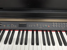 Load image into Gallery viewer, Yamaha Clavinova CLP-130 Digital Piano and stool in black stock #25457