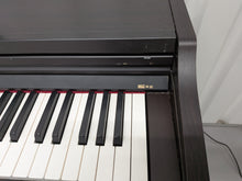 Load image into Gallery viewer, Roland RP201 Digital Piano and stool in dark rosewood finish Stock #25481
