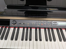 Load image into Gallery viewer, Yamaha Clavinova CLP-170PE Digital Piano glossy black polished ebony stock #25567