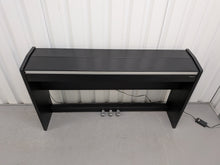 Load image into Gallery viewer, Roland F130R Digital Piano in black with matching colour stool stock # 25570
