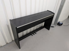 Load image into Gallery viewer, Roland F130R Digital Piano in black with matching colour stool stock # 25570