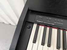 Load image into Gallery viewer, Roland F130R Digital Piano in black with matching colour stool stock # 25570