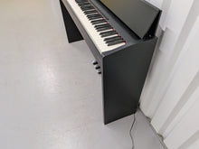 Load image into Gallery viewer, Roland F130R Digital Piano in black with matching colour stool stock # 25570