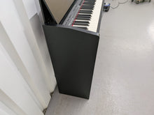 Load image into Gallery viewer, Roland F130R Digital Piano in black with matching colour stool stock # 25570