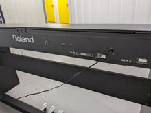 Load image into Gallery viewer, Roland F130R Digital Piano in black with matching colour stool stock # 25570