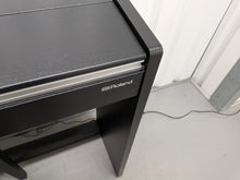 Load image into Gallery viewer, Roland F140R Digital Piano in satin black slim line space saver stock # 26052