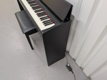 Load image into Gallery viewer, Roland F140R Digital Piano in satin black slim line space saver stock # 26052