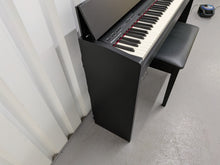 Load image into Gallery viewer, Roland F140R Digital Piano in satin black slim line space saver stock # 26052