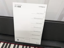 Load image into Gallery viewer, Roland F140R Digital Piano in satin black slim line space saver stock # 26052