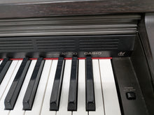Load image into Gallery viewer, CASIO CELVIANO AP-200 DIGITAL PIANO AND STOOL IN DARK ROSEWOOD stock #26059