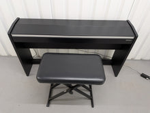 Load image into Gallery viewer, Roland F140R Digital Piano in satin black slim line space saver stock # 26060