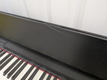 Load image into Gallery viewer, Roland F140R Digital Piano in satin black slim line space saver stock # 26060