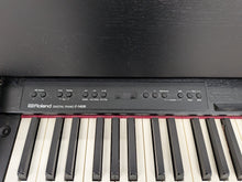 Load image into Gallery viewer, Roland F140R Digital Piano in satin black slim line space saver stock # 26060
