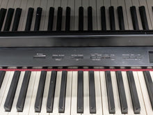 Load image into Gallery viewer, Roland HP508 digital piano and stool in polished glossy black stock number 26096