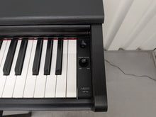 Load image into Gallery viewer, Yamaha Arius YDP-144 digital piano and stool in satin black stock #26247