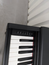 Load image into Gallery viewer, Yamaha Arius YDP-144 digital piano and stool in satin black stock #26247