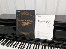 Load image into Gallery viewer, Yamaha Clavinova CLP-585 digital piano and stool in glossy black stock #26255