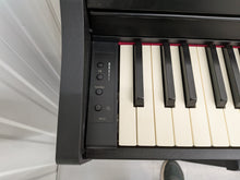 Load image into Gallery viewer, Roland RP102 digital piano and stool in satin black finish stock number 26290