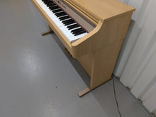 Load image into Gallery viewer, Roland HP102e digital piano in light oak finish stock number 26381