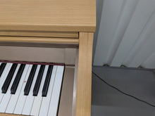 Load image into Gallery viewer, Roland HP102e digital piano in light oak finish stock number 26381