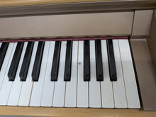 Load image into Gallery viewer, Roland HP102e digital piano in light oak finish stock number 26381