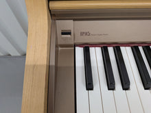 Load image into Gallery viewer, Roland HP102e digital piano in light oak finish stock number 26381