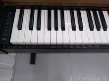 Load image into Gallery viewer, Roland HP101e Digital Piano with stool weighted keys 3 pedals, stock # 22127