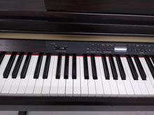Load image into Gallery viewer, YAMAHA CLAVINOVA CLP-930 Digital Piano in rosewood, weighted keys, comes with stool.  stock nr 22131