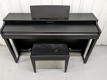 Load image into Gallery viewer, Yamaha clavinova CLP-525 digital piano and stool in satin black stock # 22378