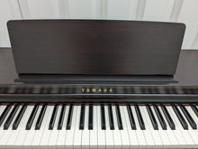 Load image into Gallery viewer, Yamaha clavinova CLP-525 digital piano and stool in dark rosewood stock # 22414