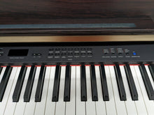 Load image into Gallery viewer, Yamaha Clavinova CLP-330 Digital Piano with matching stool in rosewood colour stock nr 23047