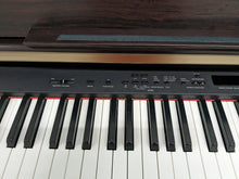 Load image into Gallery viewer, Yamaha Clavinova CLP-330 Digital Piano with matching stool in rosewood colour stock nr 23047
