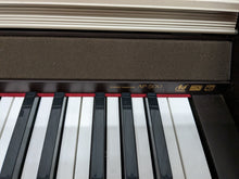 Load image into Gallery viewer, Casio Celviano AP-500 digital piano in mahogany colour stock number 23045