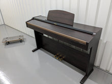 Load image into Gallery viewer, Roland HP101e Digital Piano in rosewood weighted keys 3 pedals, stock # 23082