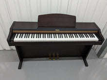 Load image into Gallery viewer, Roland HP101e Digital Piano in rosewood weighted keys 3 pedals, stock # 23082
