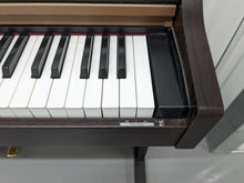 Load image into Gallery viewer, Roland HP101e Digital Piano in rosewood weighted keys 3 pedals, stock # 23082