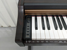 Load image into Gallery viewer, Roland HP101e Digital Piano in rosewood weighted keys 3 pedals, stock # 23082