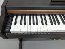 Load image into Gallery viewer, Roland HP101e Digital Piano in rosewood weighted keys 3 pedals, stock # 23082